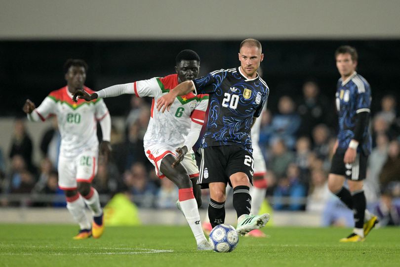 Argentina's midfielder #20 Alexis Mac Allister kicks the ball past Burkina Faso's midfielder #06 Chec Bebel Doumbia during the international friendly football match between Argentina and Burkina Faso at the Mas Monumental stadium in Buenos Aires on October 3, 2026. (Photo by JUAN MABROMATA / AFP via Getty Images)