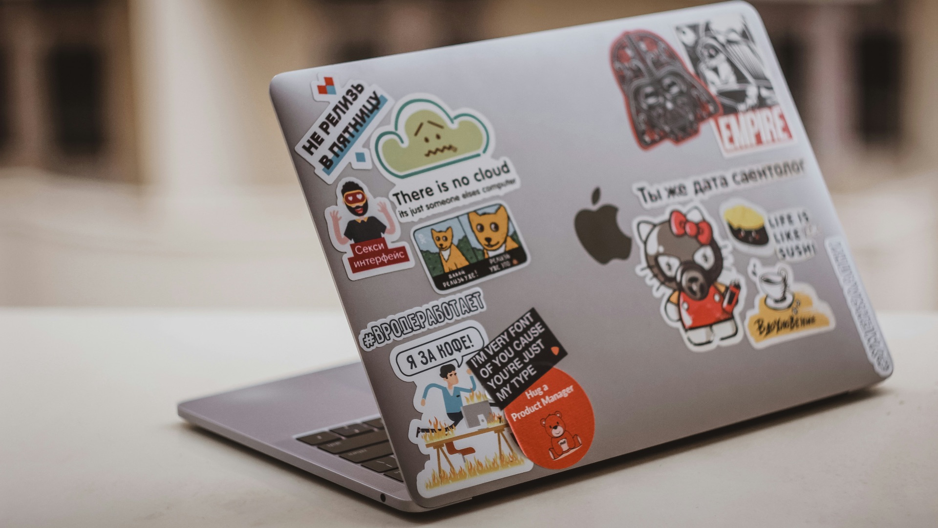 Why do people put stickers on their laptops?