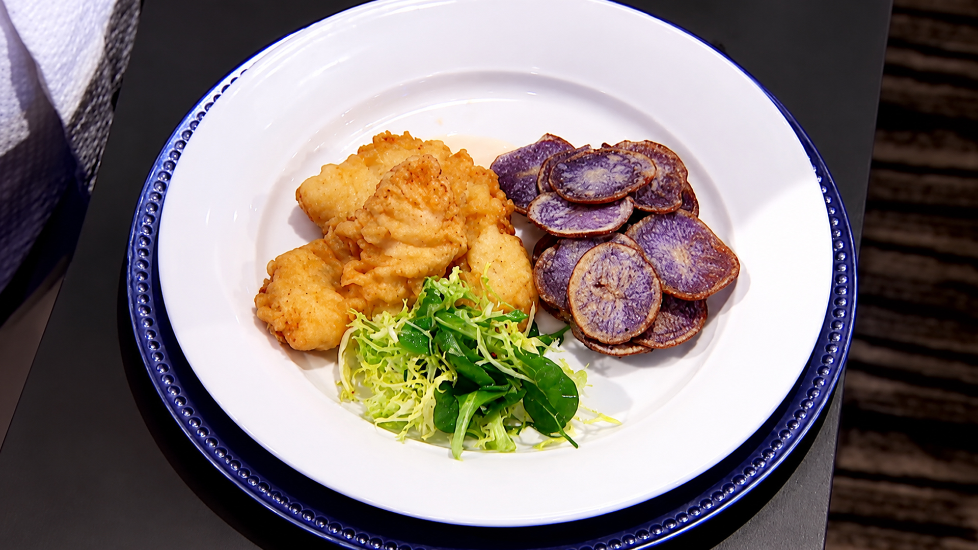 Chef serves Chef Ramsay a classic fish and chips dish