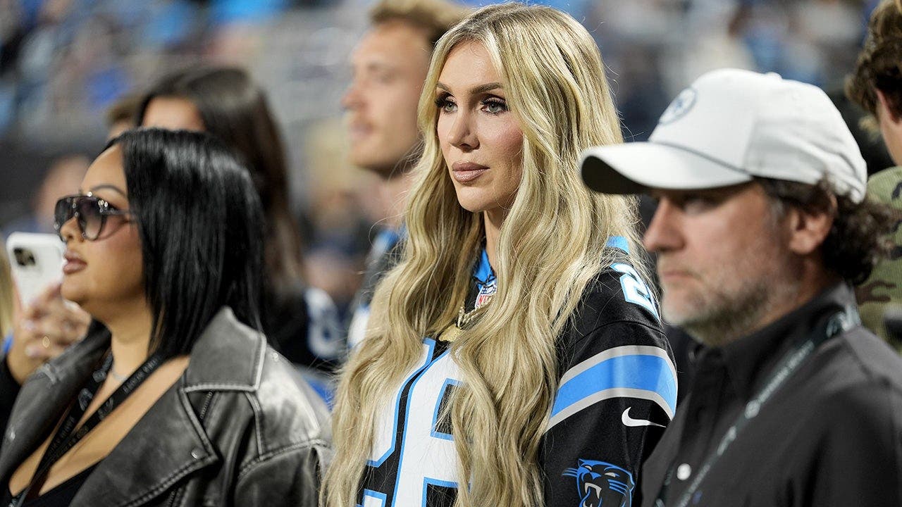 WWE star Charlotte Flair struts into Panthers' stadium, bangs the drum ...