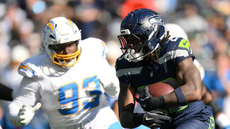 Seattle Seahawks running back Emanuel Wilson runs the ball against Los Angeles Chargers defensive tackle Teair Tart. | IMAGN IMAGES via Reuters Connect