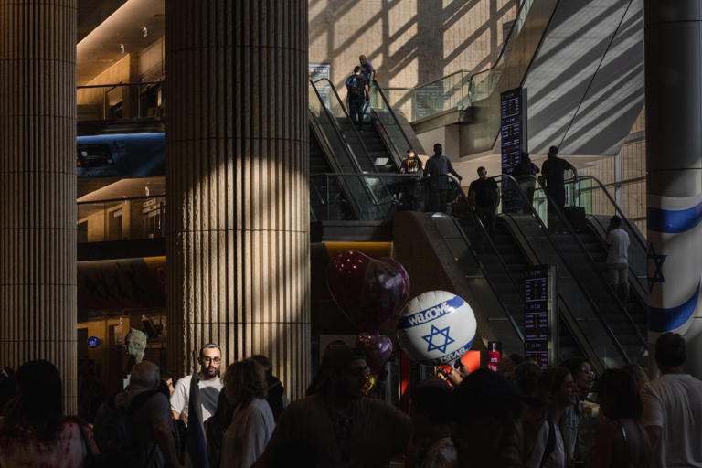 Passengers at the arrivals hall at Ben Gurion Airport in 2024.