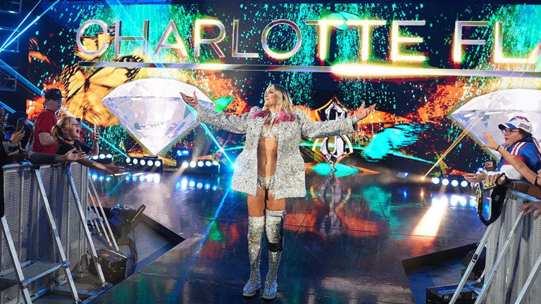 WWE star Charlotte Flair struts into Panthers' stadium, bangs the drum ...