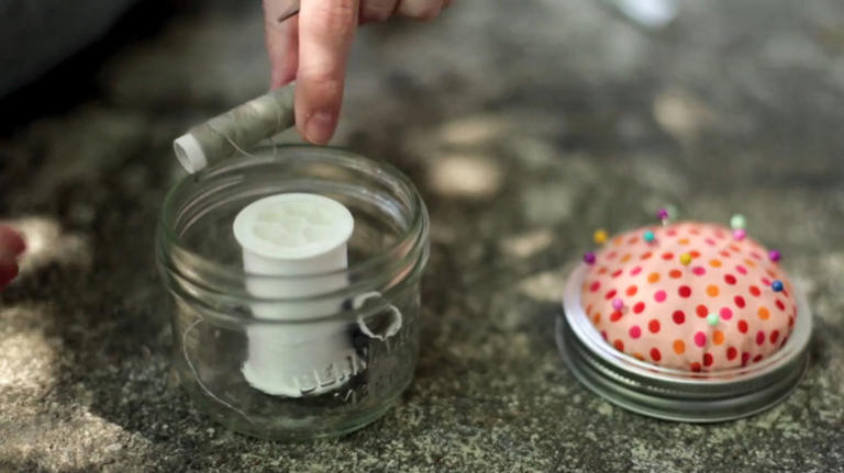 Savvy upcyclers transform old glass jars into a sewing kit with an ...