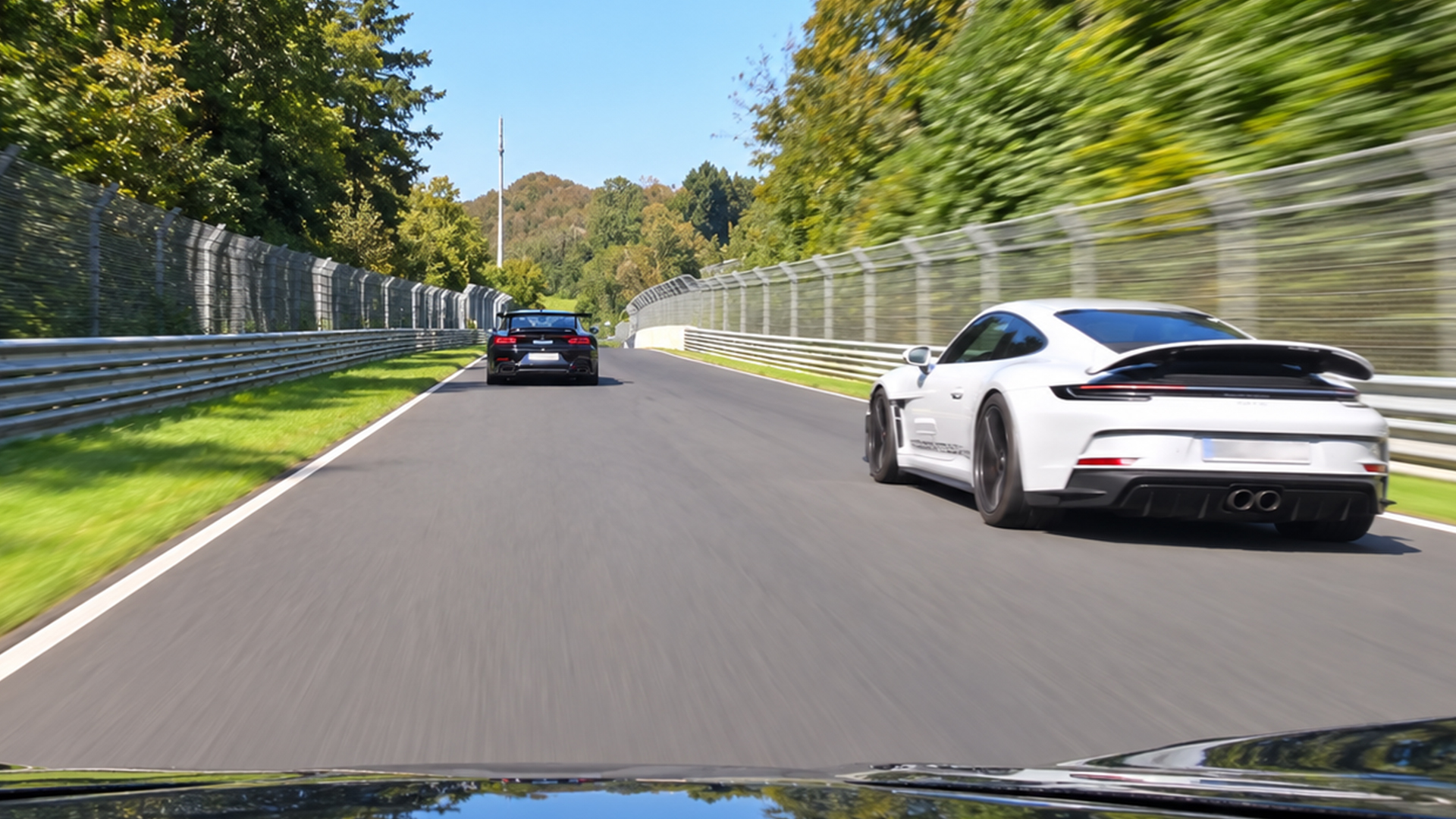 Porsche 911 GT3 RS surges past on a Nürburgring straight