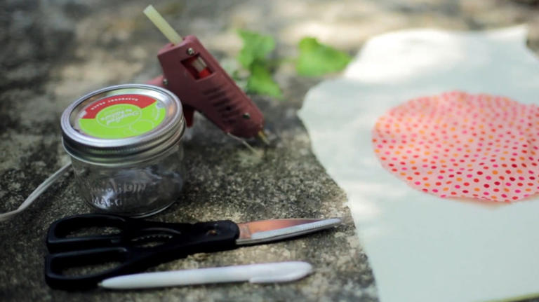 Savvy upcyclers transform old glass jars into a sewing kit with an ...