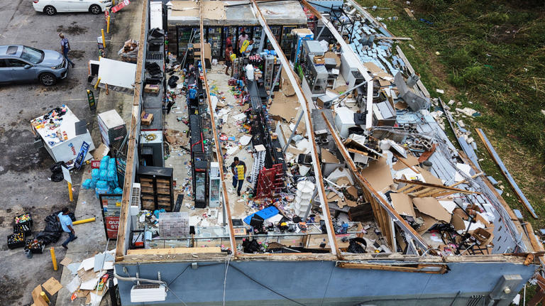 Isaias leaves trail of damage as it moves inland, in photos