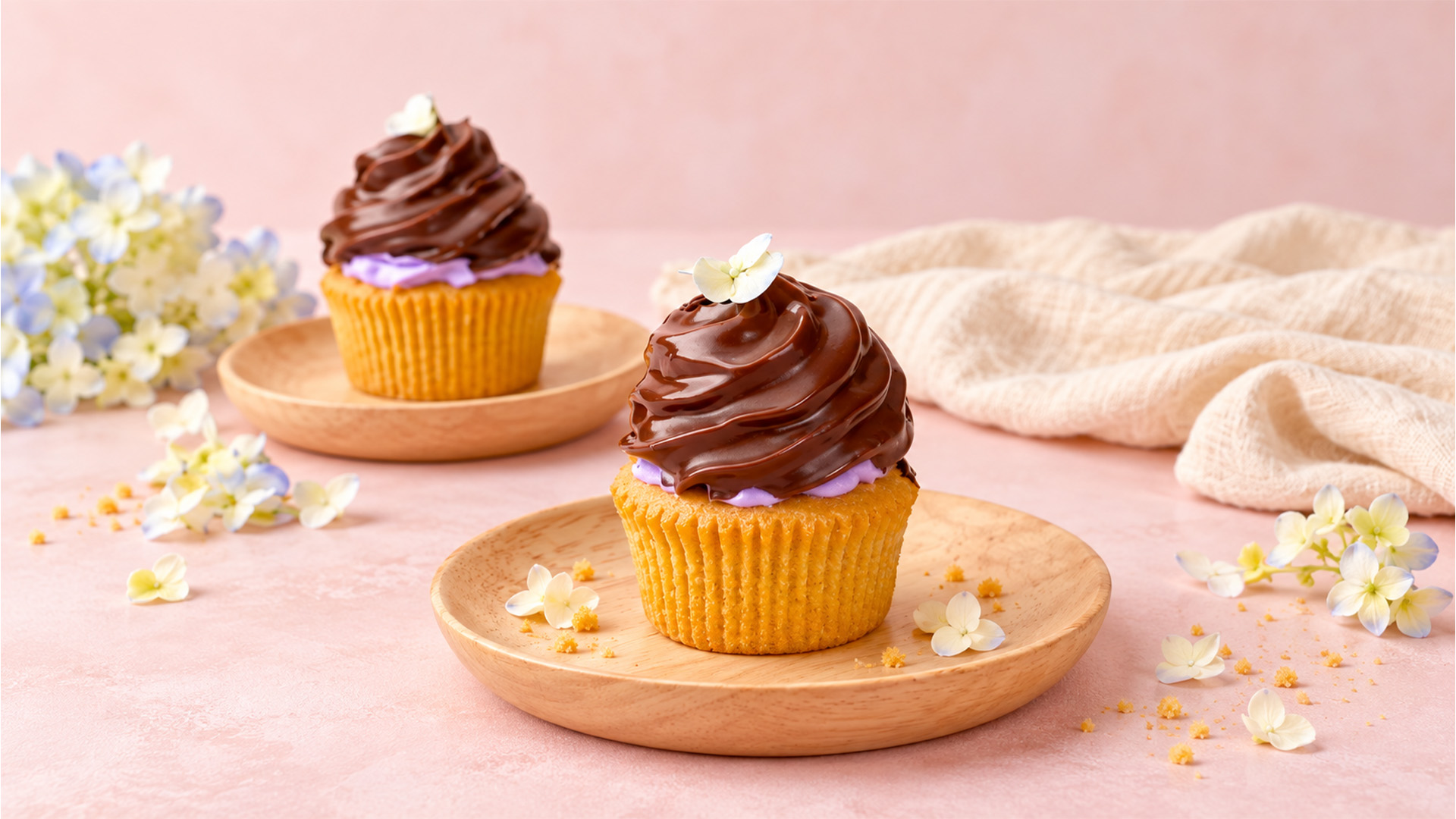 Vanilla cupcakes with chocolate and berry frosting