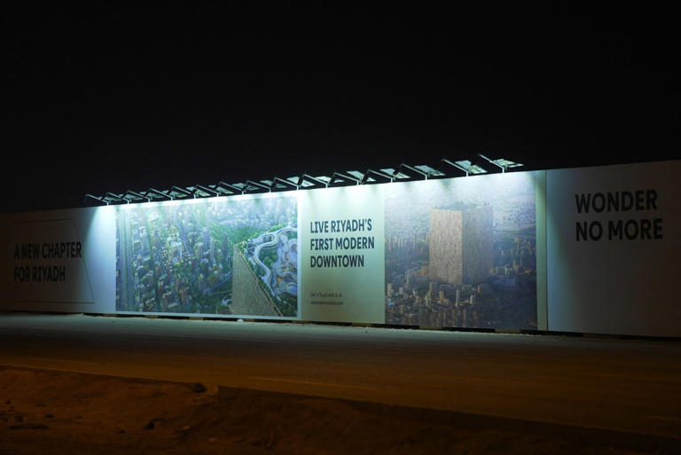 A billboard advertises a new development in Riyadh.