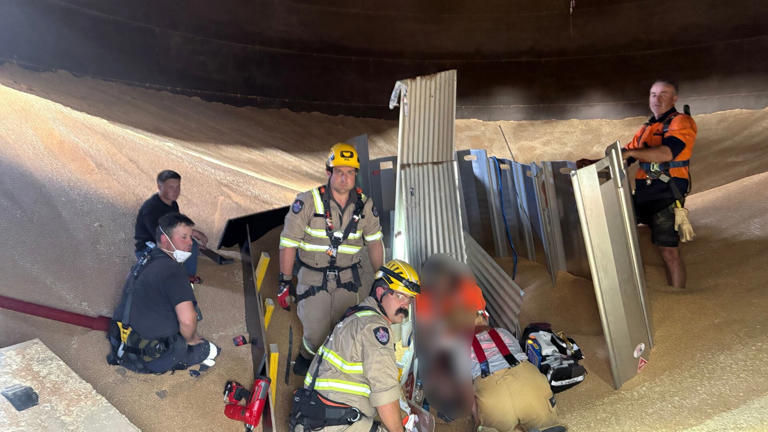 Rescuers detail operation to free worker from grain silo in central ...