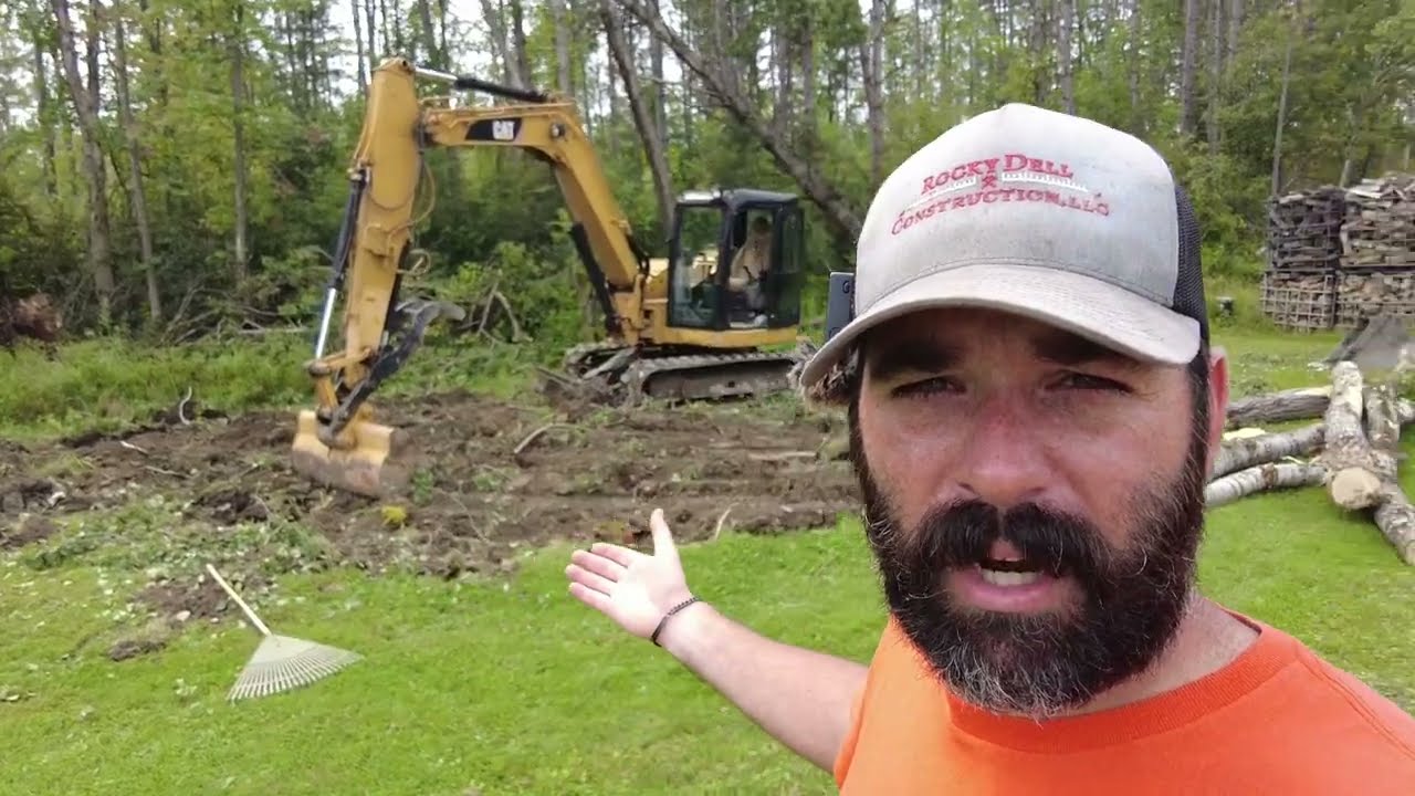 Clearing land with a mini excavator