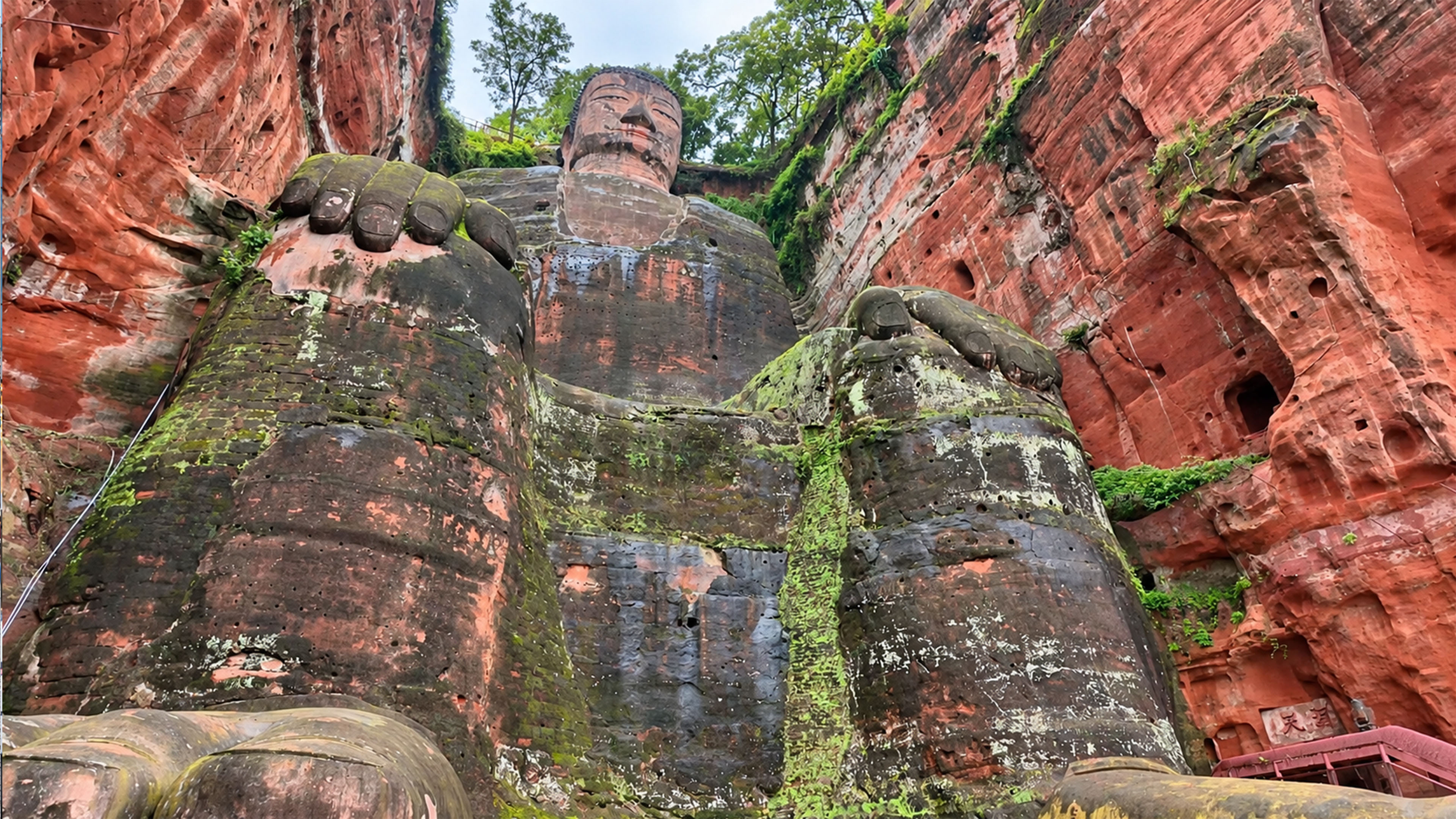 China hides a giant Buddha inside a red cliff