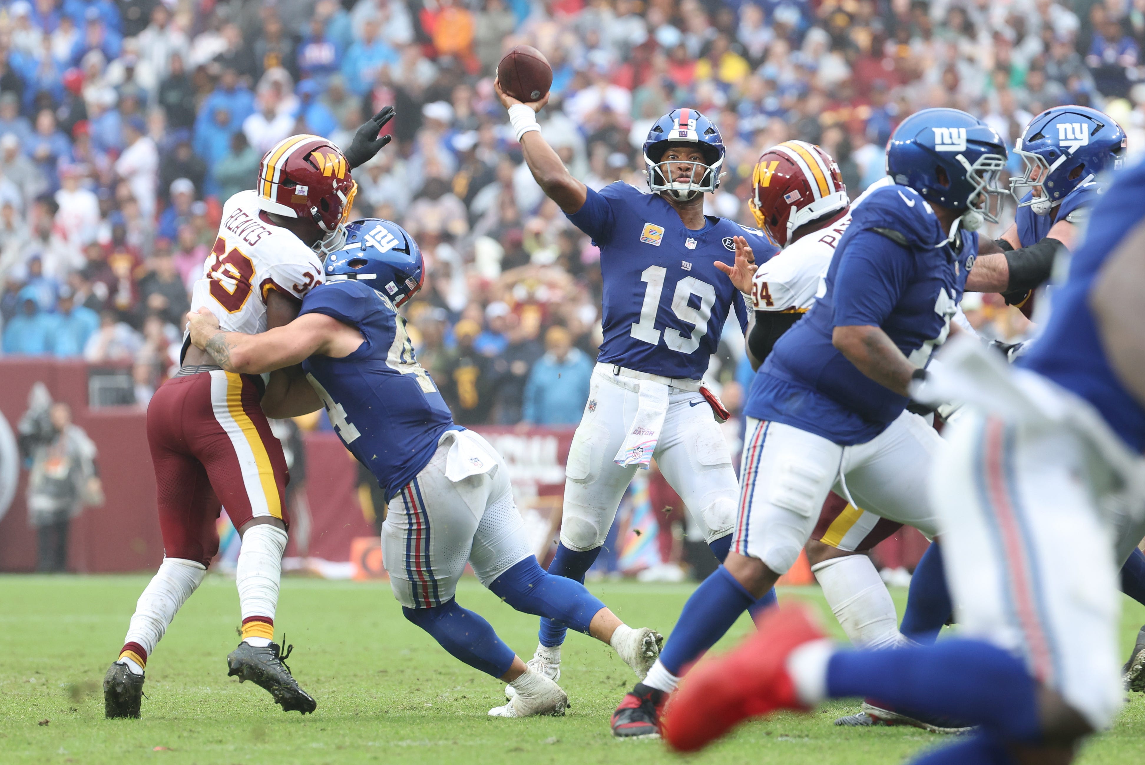 Eagles stay in NFC East race as Giants, Commanders finish in a tie