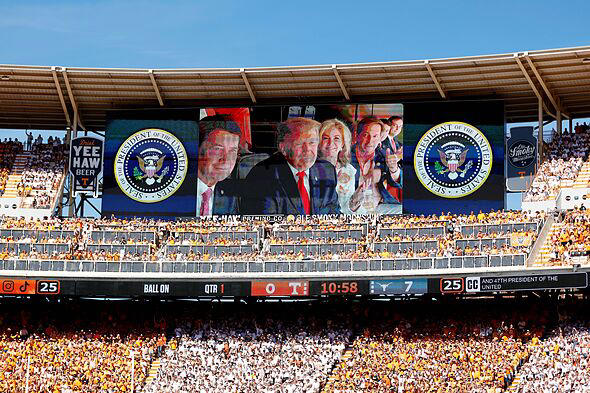 Donald Trump can't resist chance to goad college football fans at rally