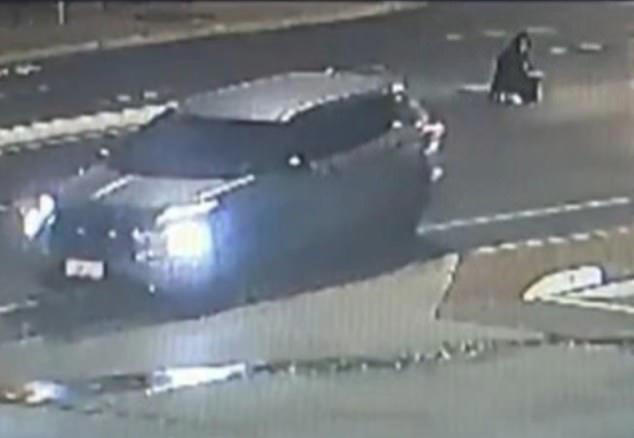CCTV footage showing Malik kneeling in the middle of the road, moments before she was struck and killed 