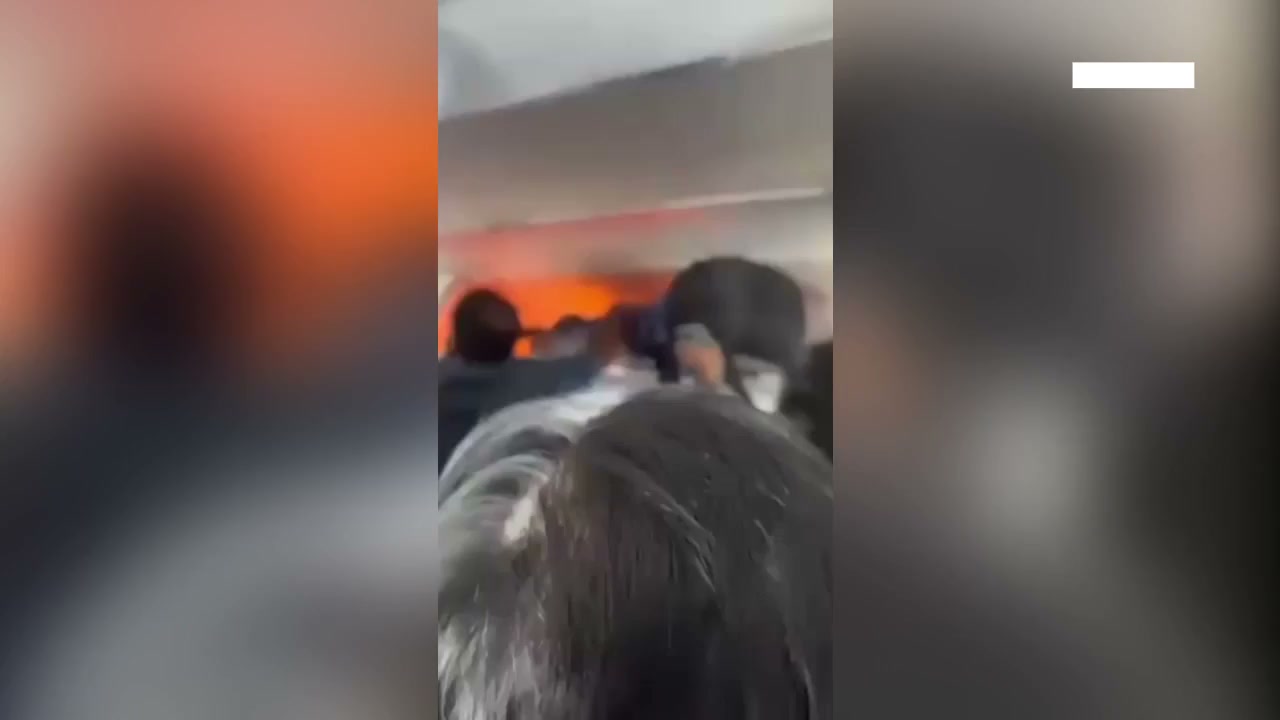 Power bank bursts into flames on flight as passengers battle blaze