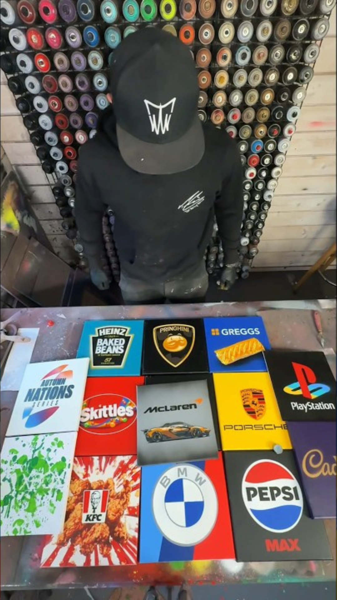 Custom spray paint art featuring iconic car brand logo