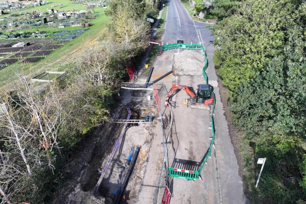Images show work ongoing to repair double water main failure on key routes