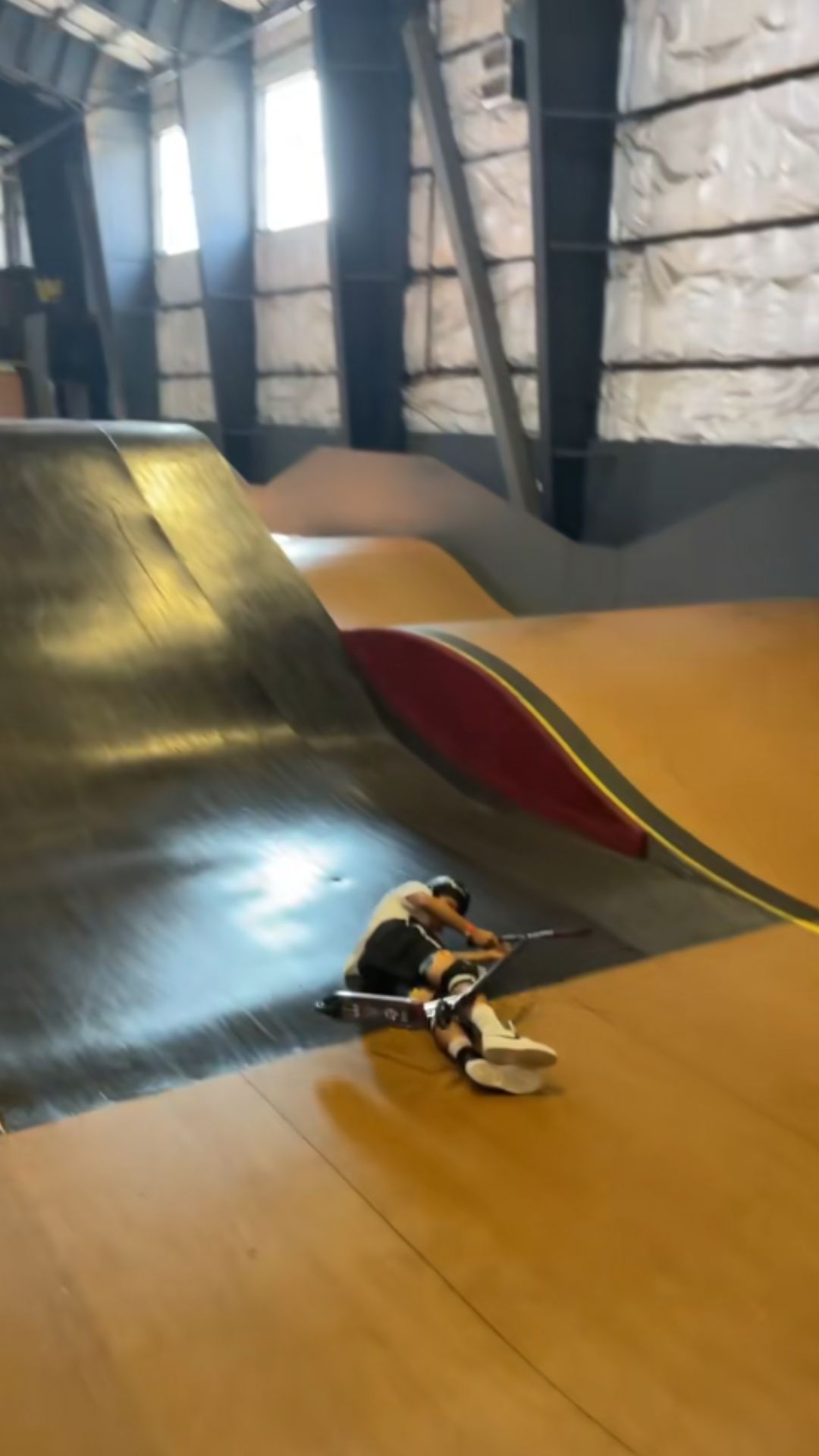 Massive scooter ramp crash at an indoor skatepark