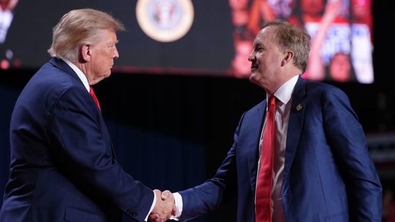 President Donald Trump greets Texas Attorney General Ken Paxton at a campaign rally at the Freeman Coliseum in San Antonio, on Wednesday. - Alex Brandon/AP