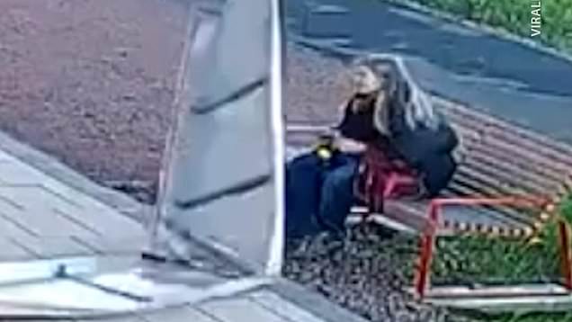 Woman has close call with falling metal panels