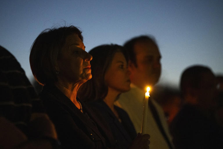 Klobuchar attending a vigil in 2025 following a deadly school shooting.