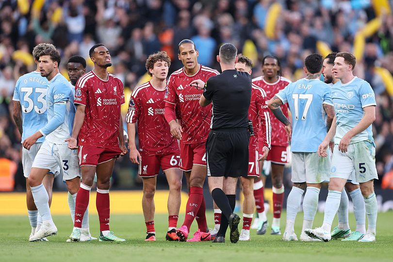 LIVERPOOL, ENGLAND - OCTOBER 11: Liverpool players react towards referee Chris Kavanagh after Ryan Gravenberch of Liverpool is sent off during the Premier League 2026/27 match between Liverpool FC and Manchester City at Anfield on October 11, 2026 in Liverpool, England. (Photo by Alex Pantling/Getty Images)