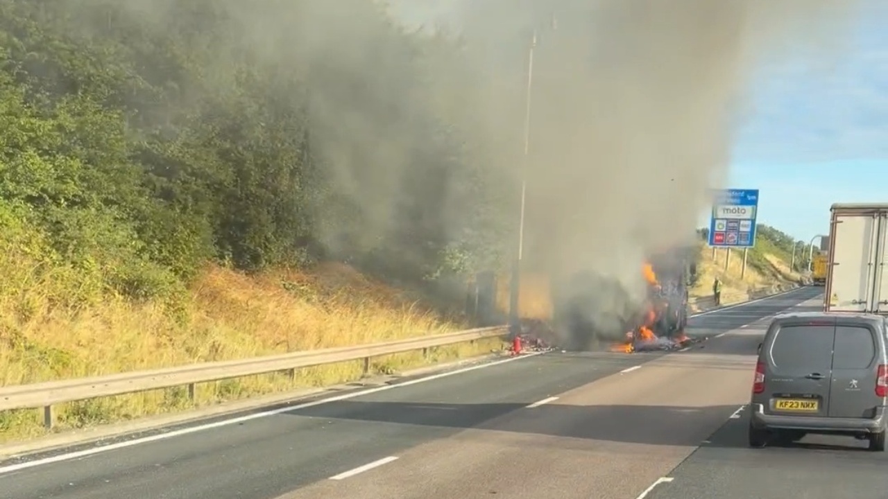 Large vehicle engulfed in flames following tire explosion on M6