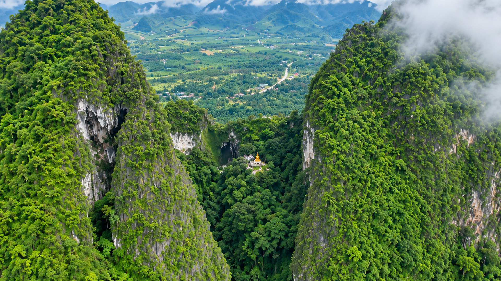 Thailand’s mountain cliffs almost hide this temple