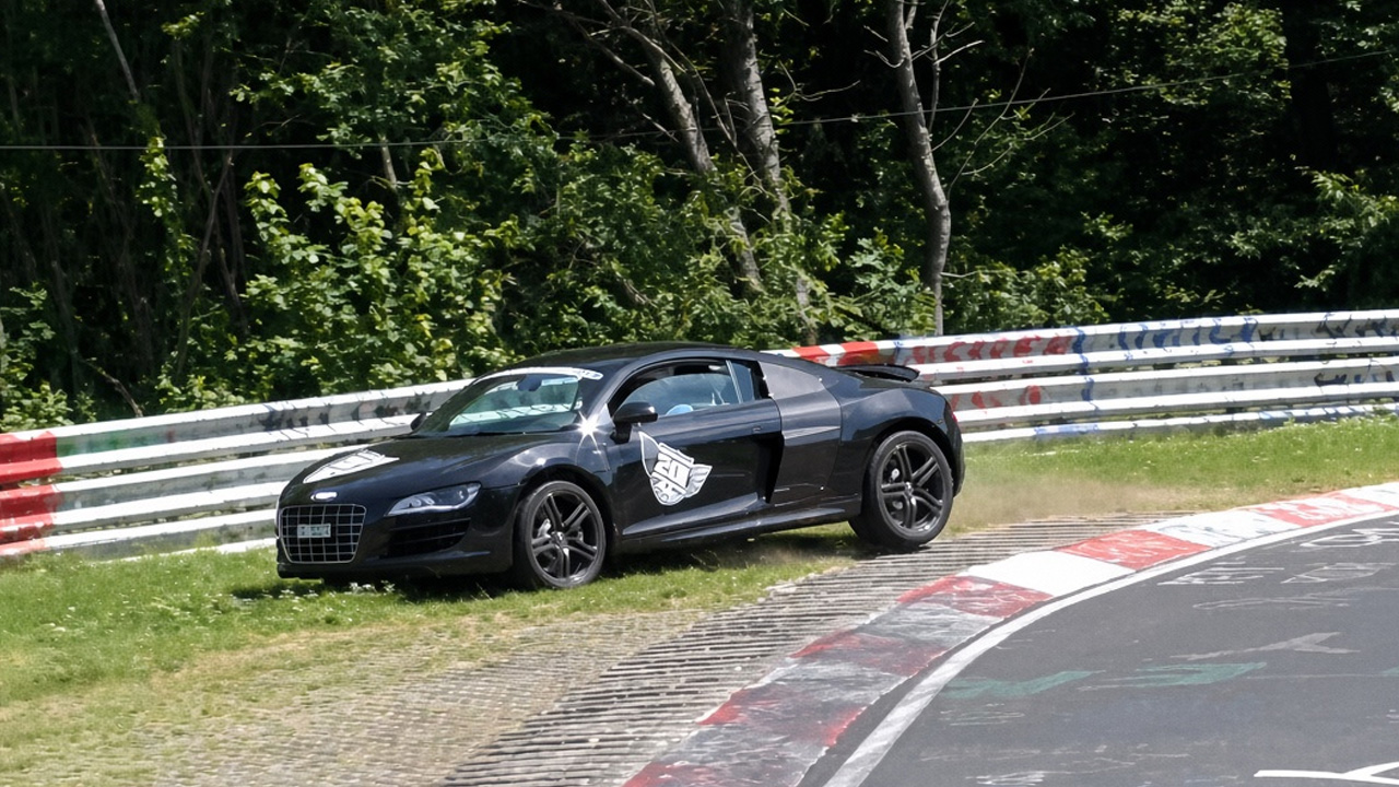 Close call: Audi R8 clips barrier after high speed off-track excursion