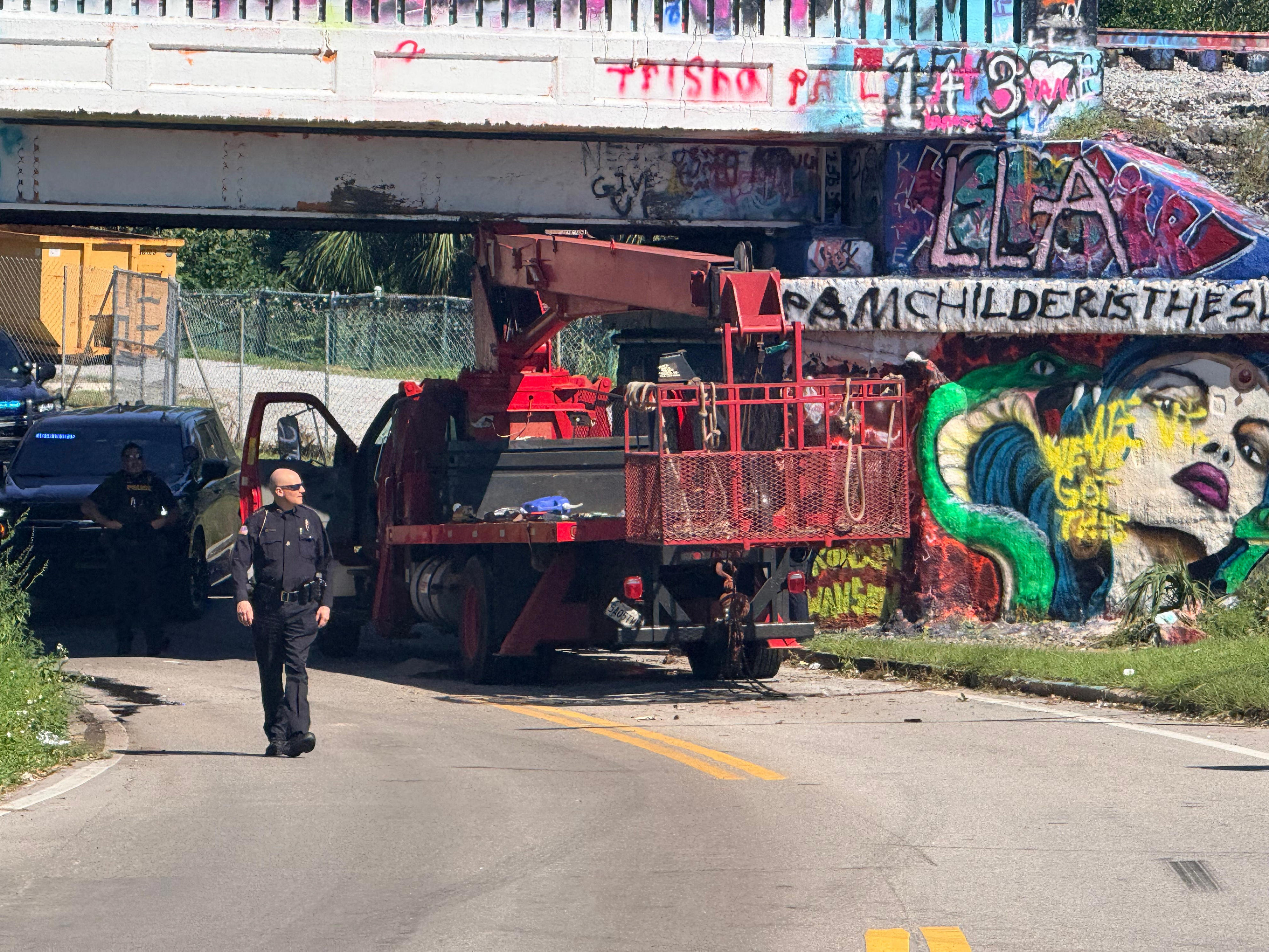 Graffiti Bridge reopens after bucket truck hit overpass, injured occupant