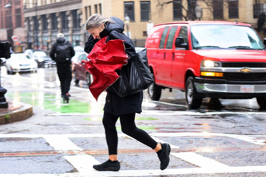 Pedestrians struggled in the wind and rain on Tremont Street.
