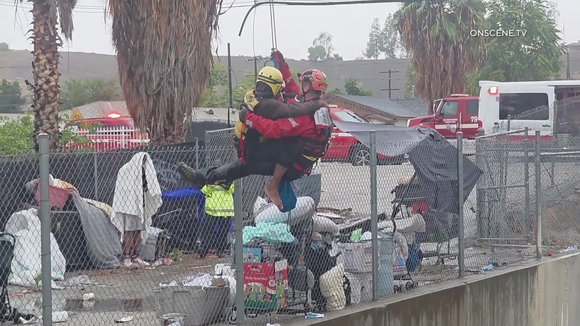 Homeless people in sewer rescued from rising flood water