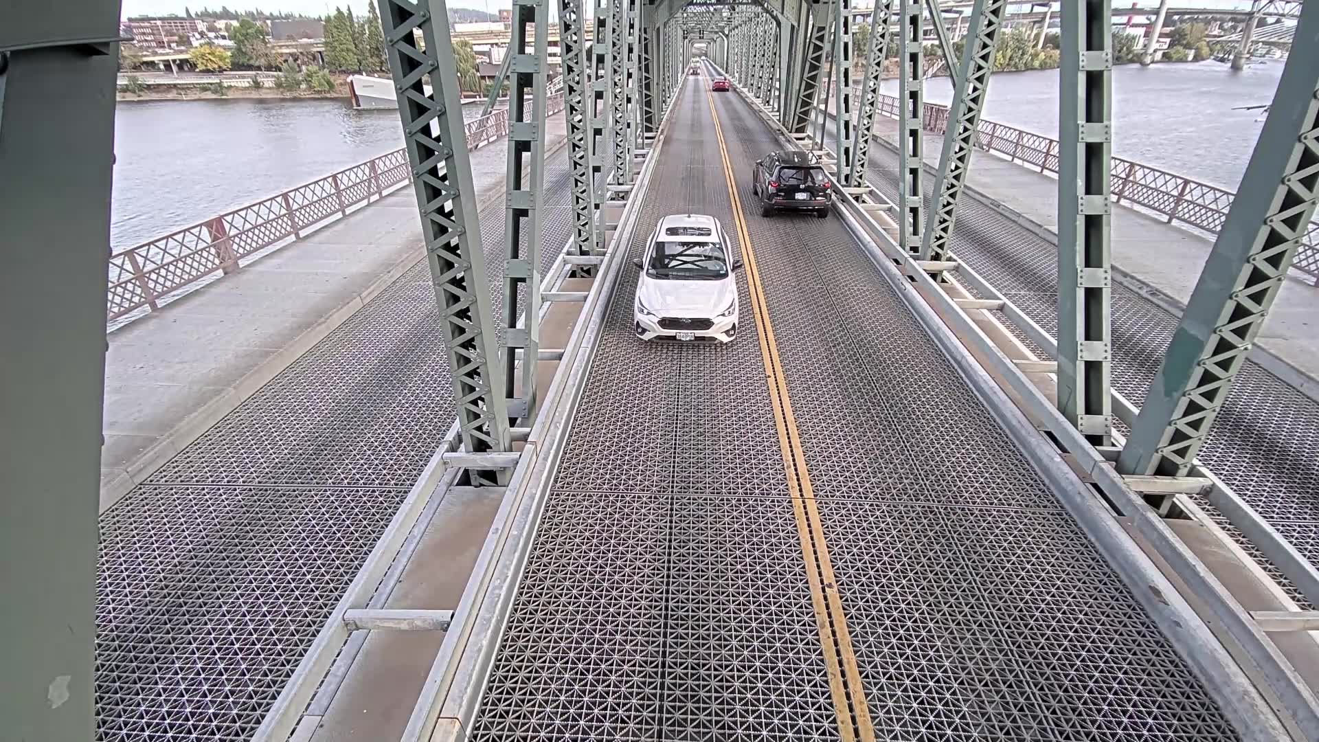 Seaplane takes off underneath Hawthorne Bridge