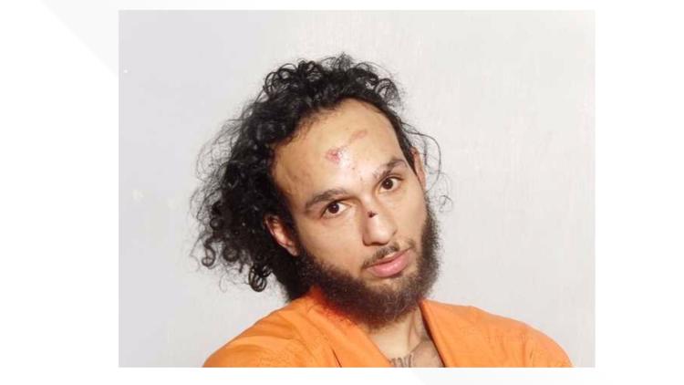 Man allegedly spit on officer, kicked-in cruiser door during arrest ...
