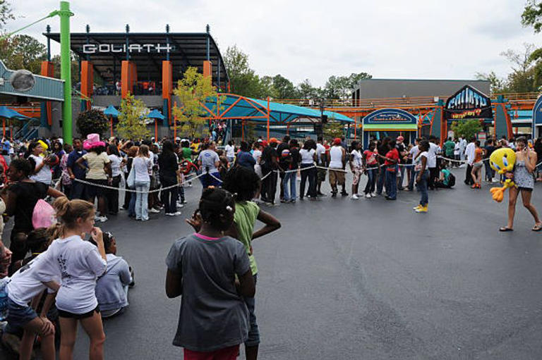 Man dies after fall from giant rollercoaster while son strapped in ...