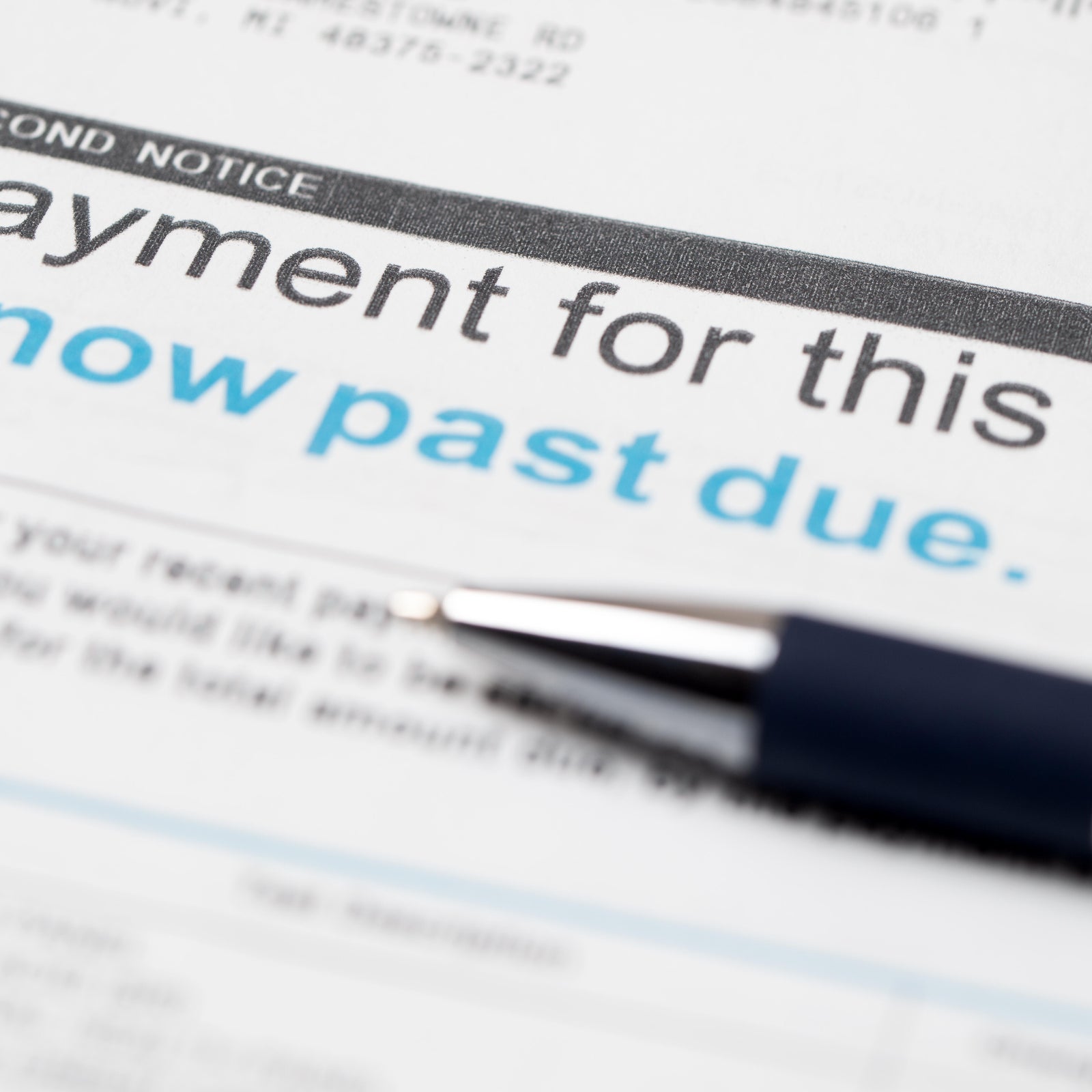 Squeezed by inflation, more Americans fall behind on their debts