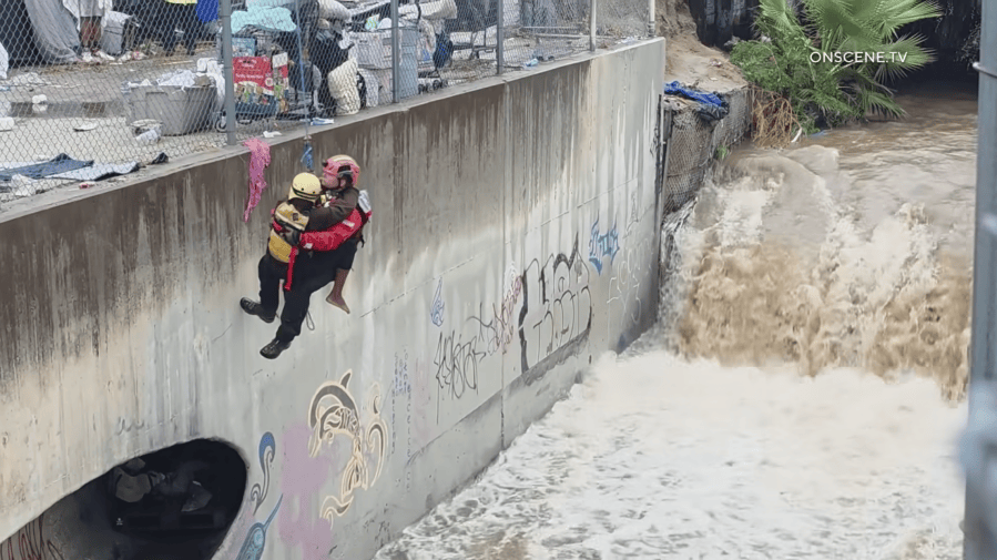 Homeless people trapped in sewer by rising flood water rescued