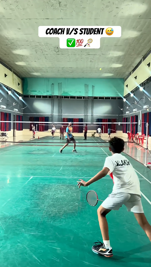Badminton coach and student practice