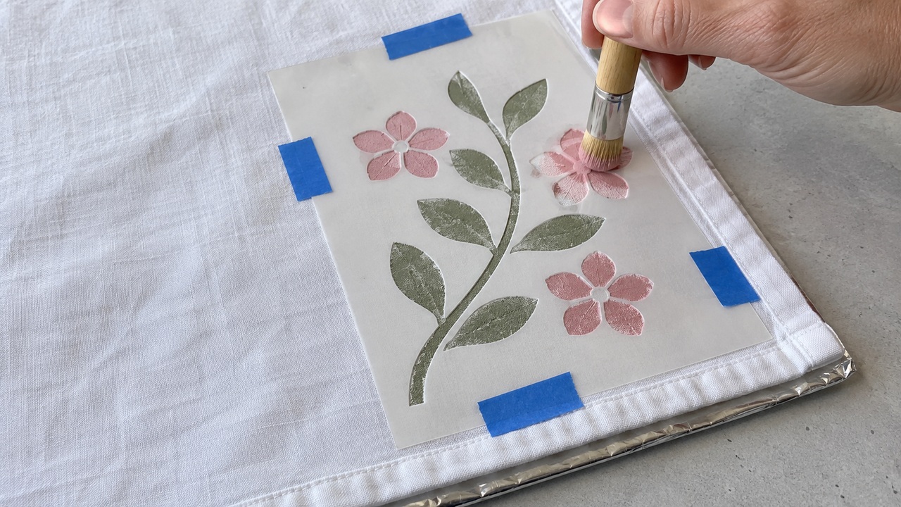 Turn plain tea towels into colorful kitchen accents with stencils
