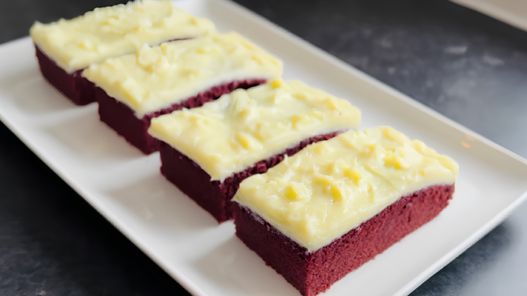 Fudgy red velvet brownie cake with creamy cream cheese topping