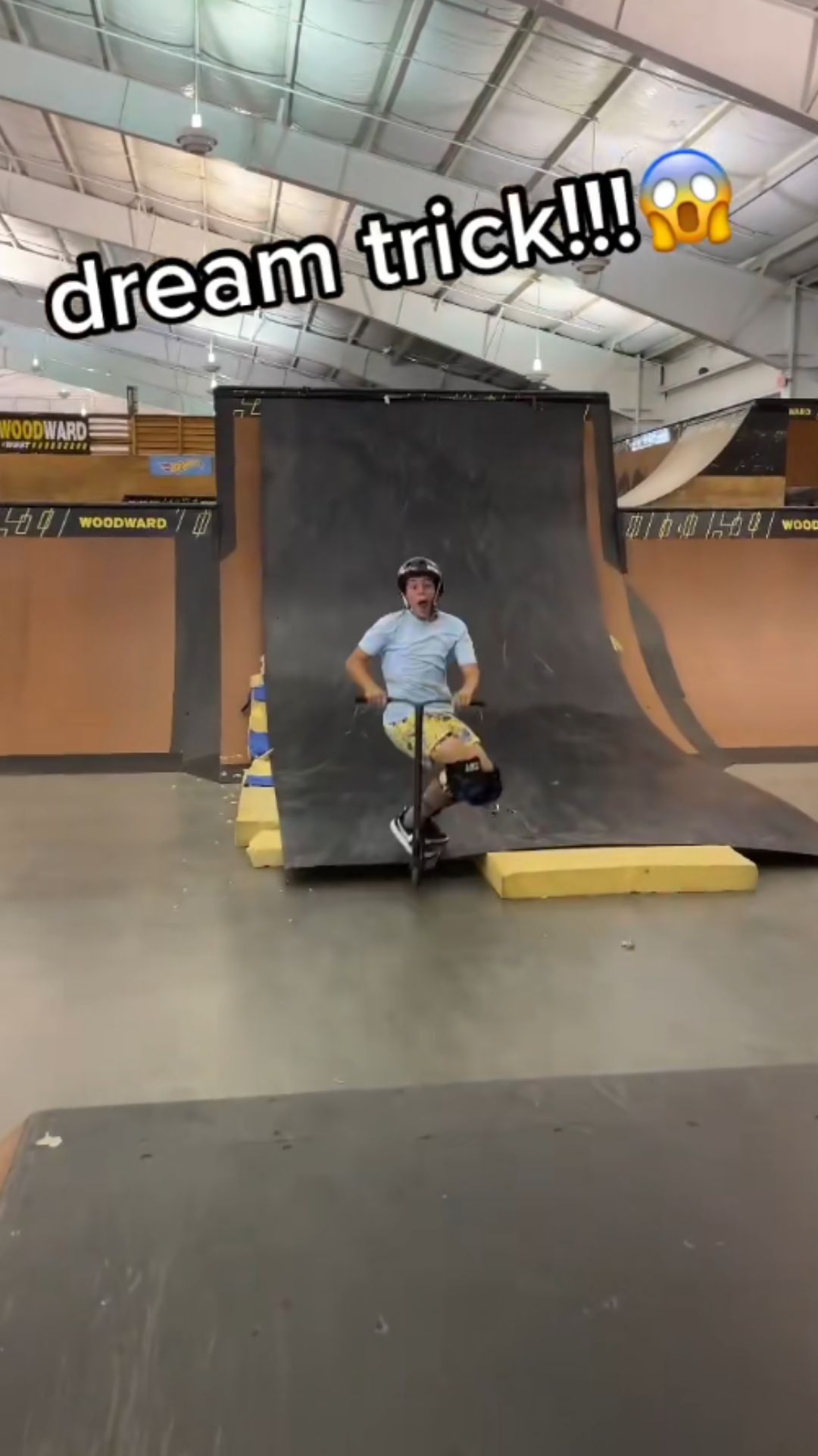 Chasing a dream freestyle scooter trick on the skatepark ramp