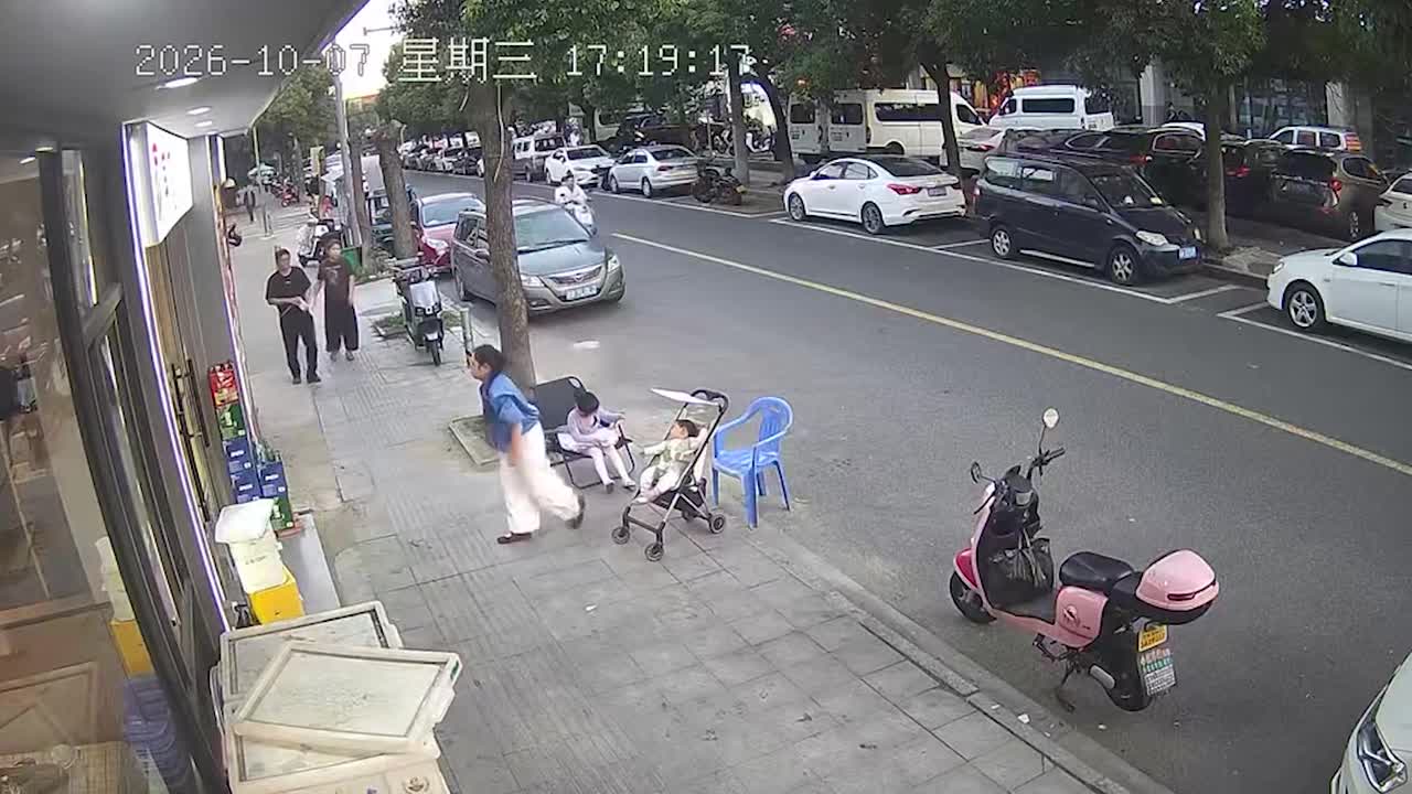 Mother's quick trip inside shop ends with baby's stroller tipping over