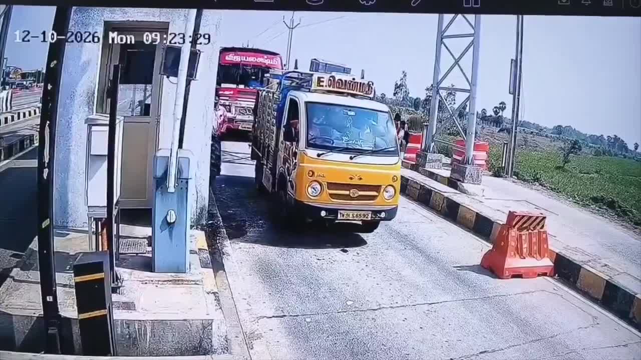 Pedestrian struck on the head by a toll barrier while walking through ...