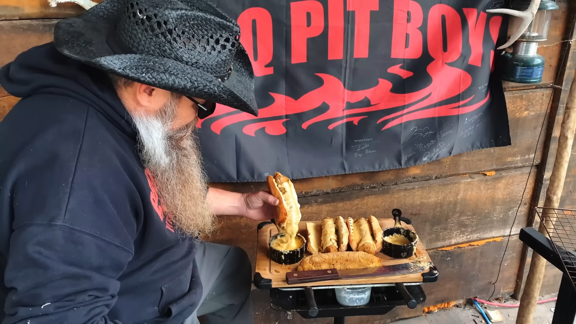 Bacon-wrapped hot dogs get a mashed potato crust on the grill