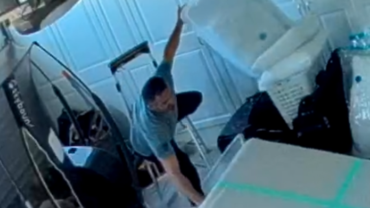 Woman Burst Into Laughter After Her Husband Falls Over Boxes