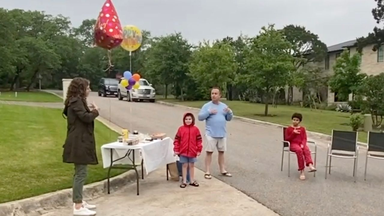 Boy who is deaf surprised with happy birthday signed by neighbors | Happily