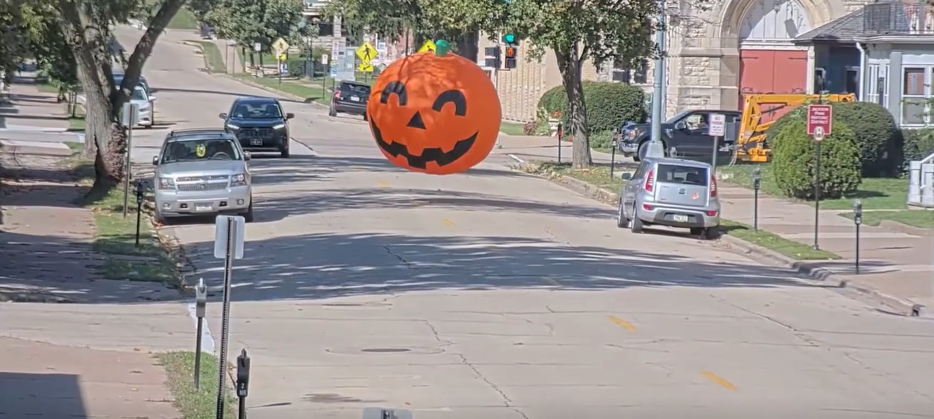 Giant inflatable pumpkin decoration gets loose, rolls through the street