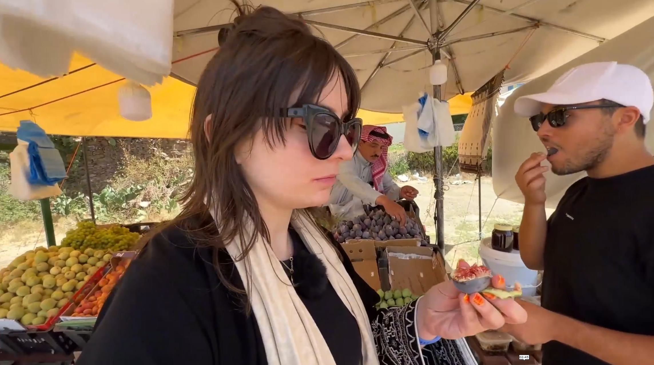 Trying local fruits in Saudi Arabia's Aseer Mountains