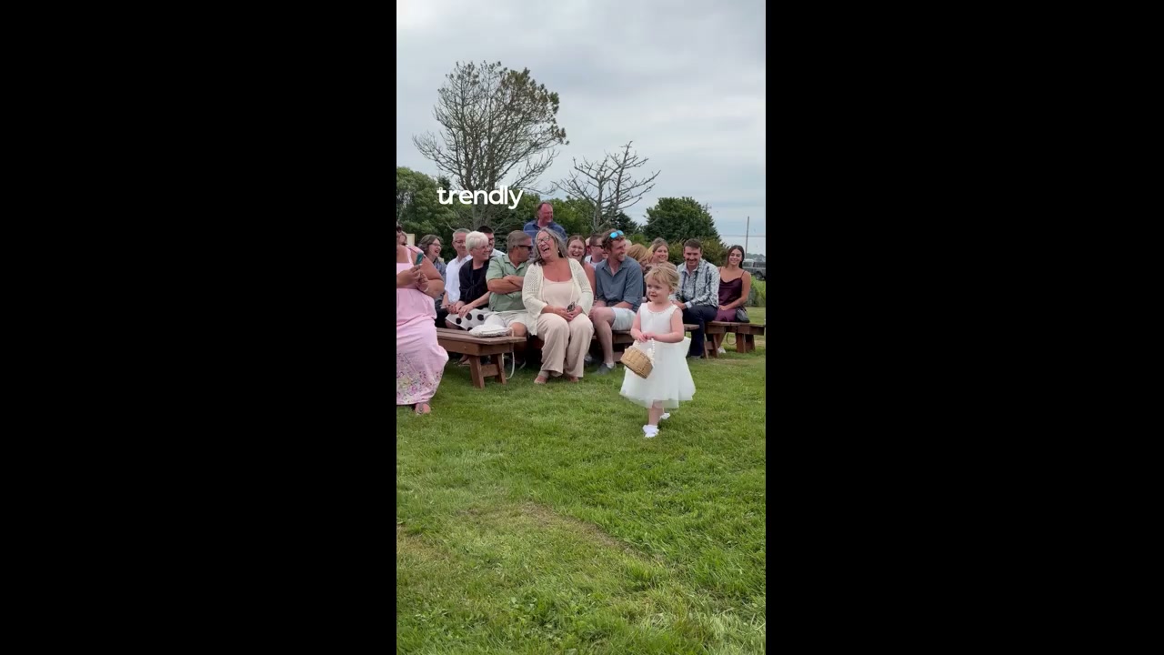 Sibling rivalry erupts as flower girl disapproves of brother's embrace